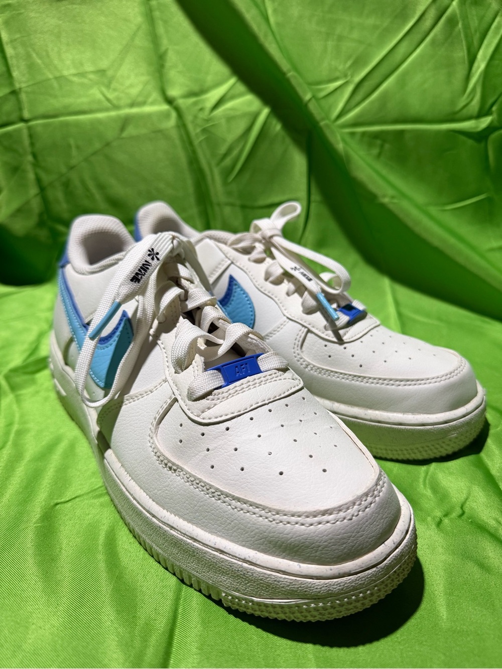 Nike Kids White Sneakers with Light Blue Swoosh